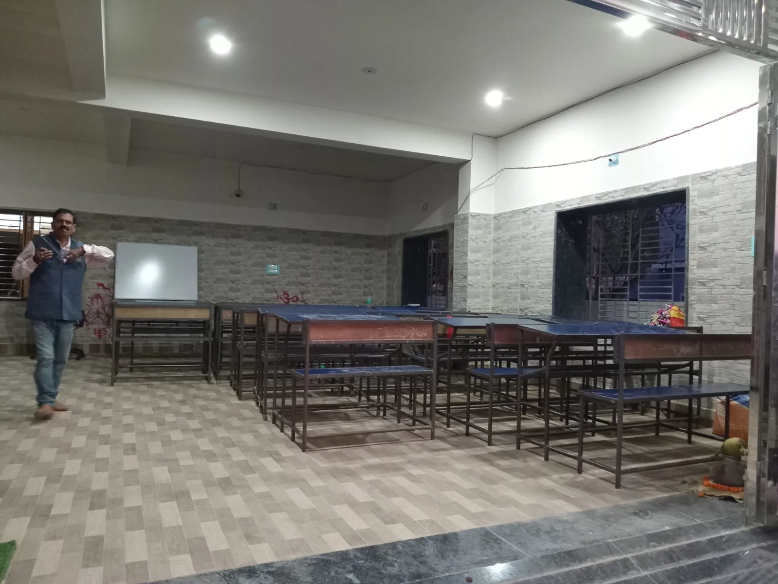 Baman Foundation classroom with desks and teaching board